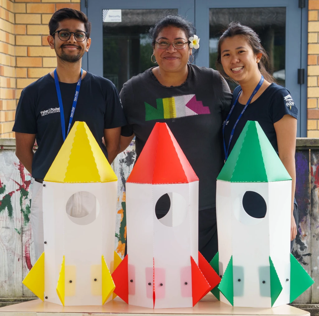 Volunteering with preschoolers to build rocket-shaped rubbish bins